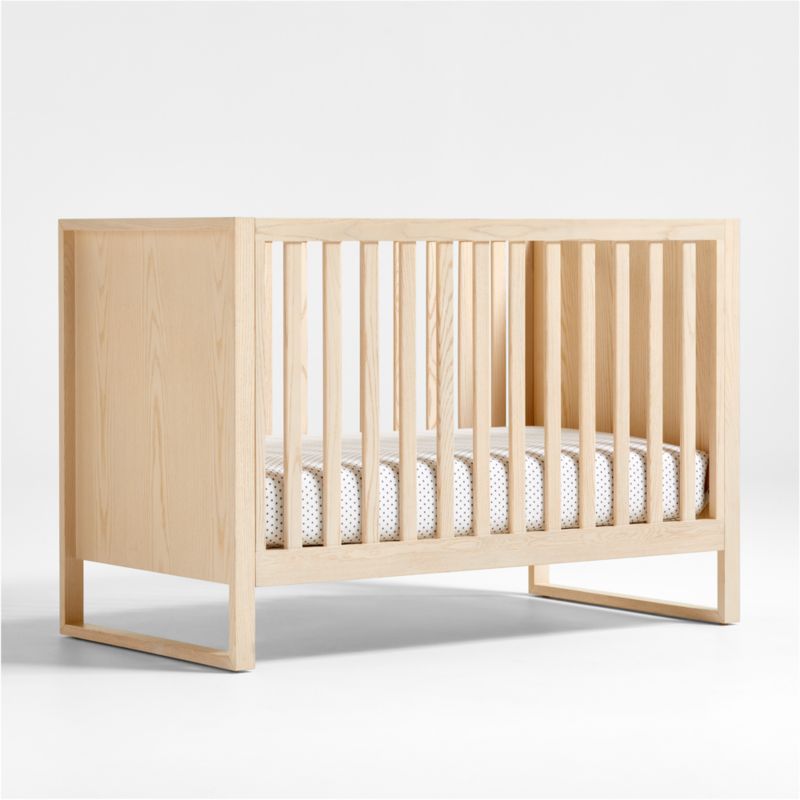 https://cb.scene7.com/is/image/Crate/GeminiWoodCrib3QSSS23